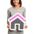Woman with house sign Woman with house sign