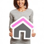 Woman with house sign Woman with house sign