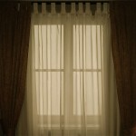 Window with diaphanous curtains