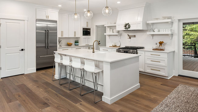 white kitchen with wood flooring